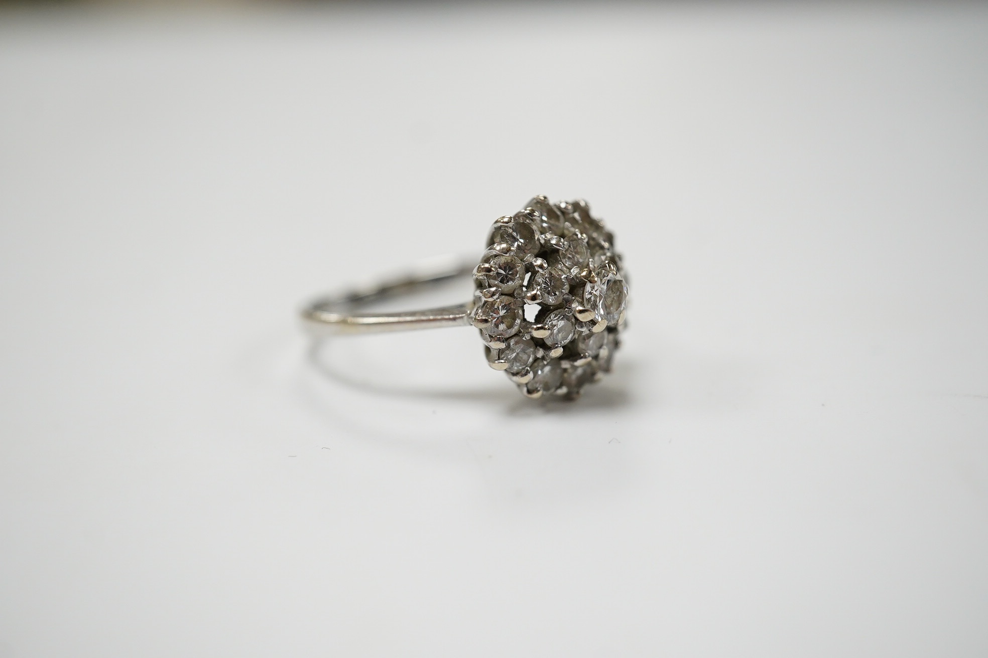 A 1970's 18ct white gold and diamond cluster set ring, size L, gross weight 3.2 grams, Condition - fair to good